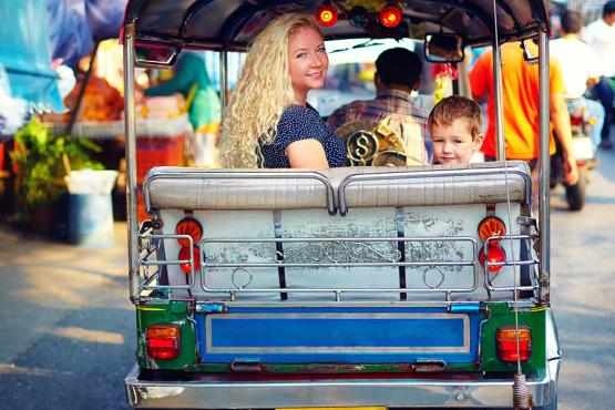 Ride through the busy streets of Bangkok in a tuk-tuk