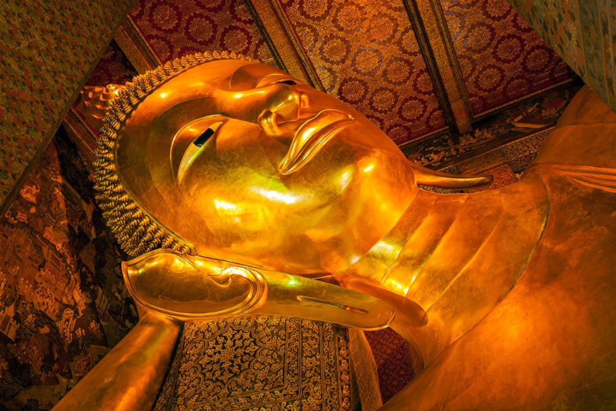 See the reclining Buddha at Wat Pho temple